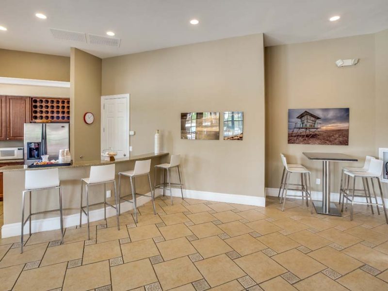 This image shows the front view of the luxury café lounge of TGM Malibu Lakes Apartment featuring the coffee bar.