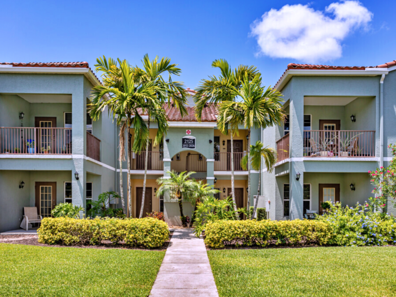 This image shows the front view of the cozy establishments in TGM Malibu Lakes Apartments in Naples, FL.