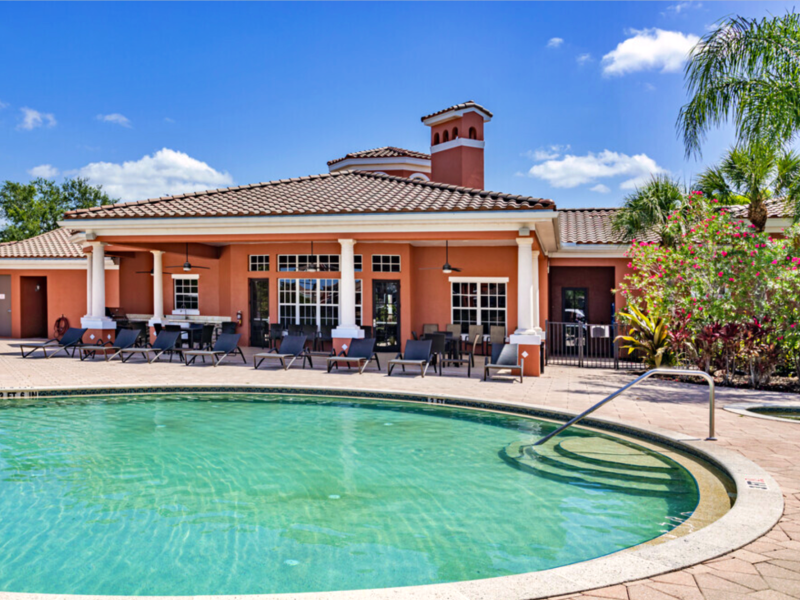 This image shows the resort-style outdoor swimming pool with a glittering pale blue water that was admirable for the fun bond with friends and family.