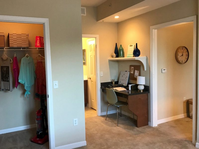 This image shows the Premium Apartment Feature, especially the oversized closet showcasing a spacious and comfy place to put your clothes.